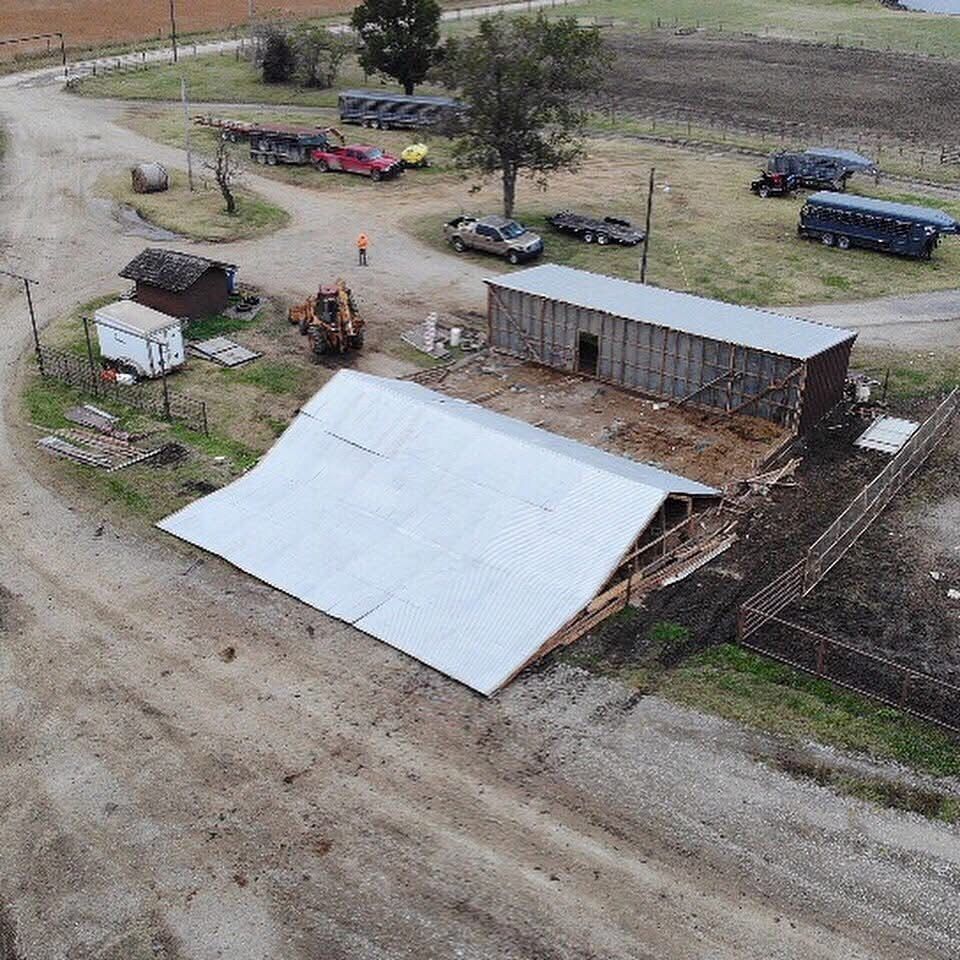 Aerial view of an old barn being torn down